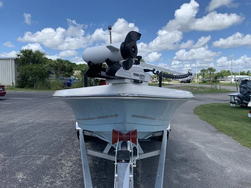 Slide: The Image of 2025 Bulls Bay 2200 boat with Minn Kota motor on trailer, under a blue sky. - 7