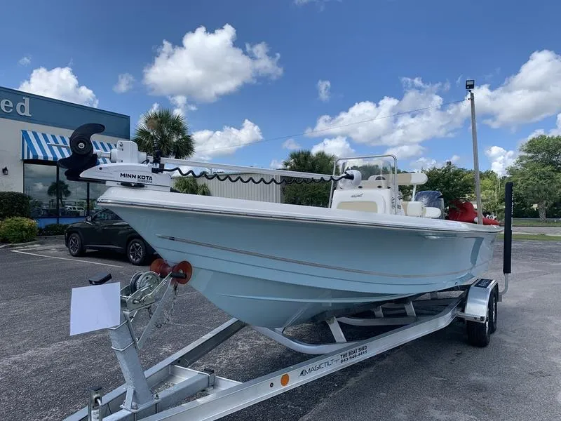 Slide: The Image of 2025 Bulls Bay 2200 boat on trailer with Minn Kota motor, parked outdoors. - 8