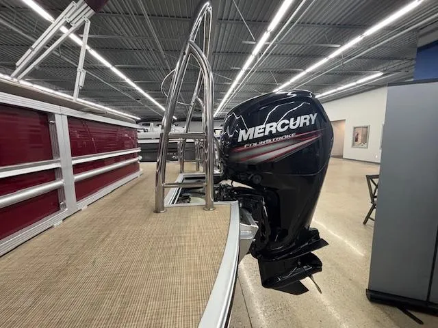 Slide: The Image of 2016 Harris Solstice 220 SL pontoon boat with Mercury outboard engine in showroom. - 20