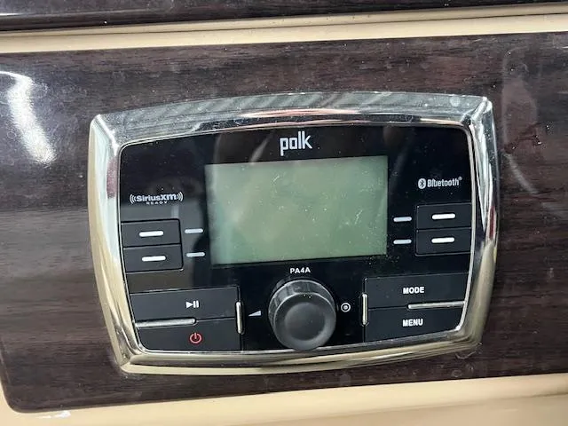 Slide: The Image of Polk audio system on 2016 Harris Solstice 220 SL boat dashboard. - 5