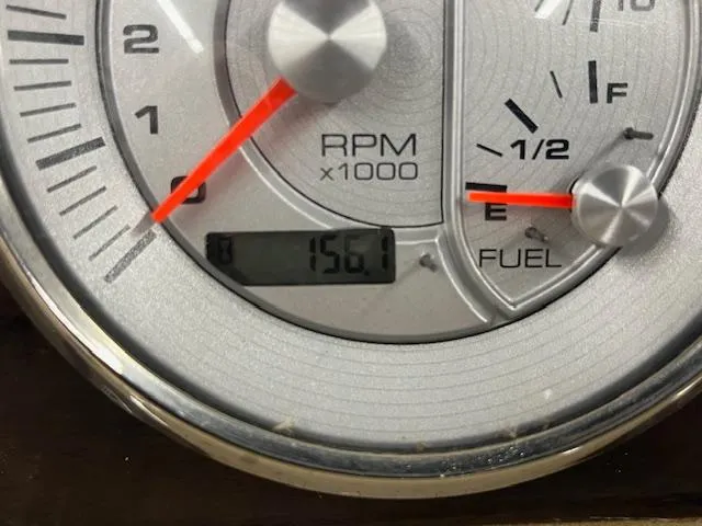 Slide: The Image of Close-up of a 2016 Harris Solstice 220 SL tachometer and fuel gauge, showing 156.1 hours. - 6