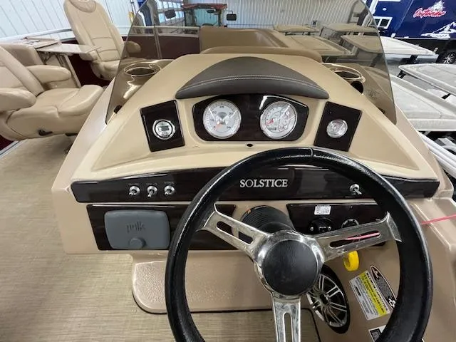 Slide: The Image of 2016 Harris Solstice 220 SL boat dashboard with steering wheel and gauges. - 7