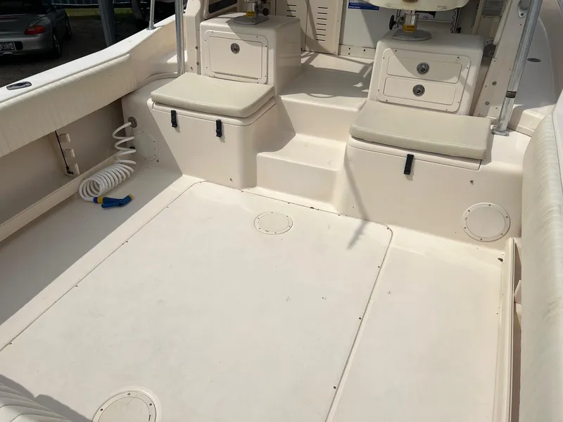 Slide: The Image of 2008 Grady-White 282 Sailfish WA boat interior with seating and storage compartments. - 10