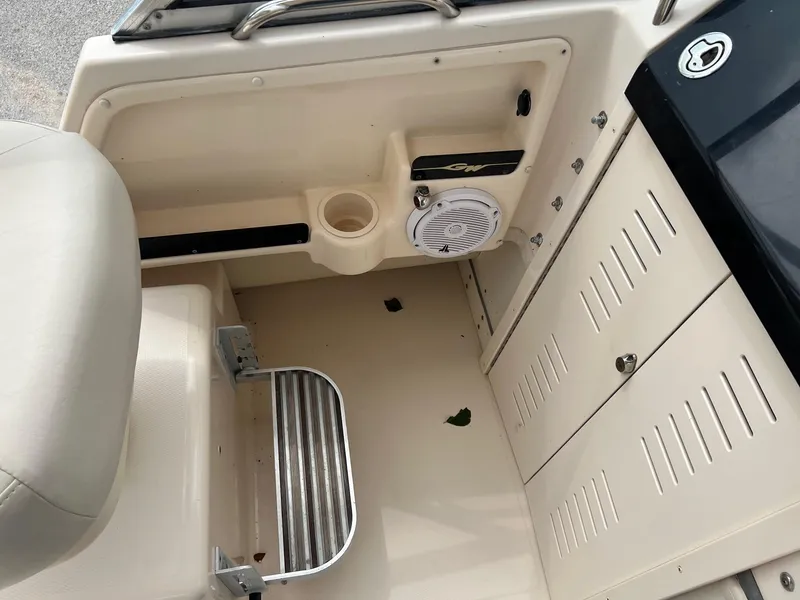 Slide: The Image of 2008 Grady-White 282 Sailfish WA boat interior with speaker and storage compartments. - 18