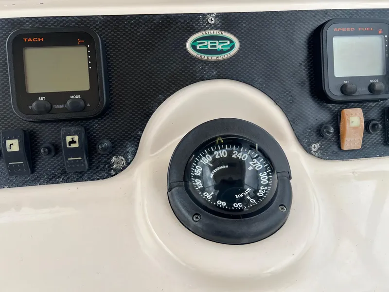 Slide: The Image of Dashboard of 2008 Grady-White 282 Sailfish WA with compass and digital displays. - 25