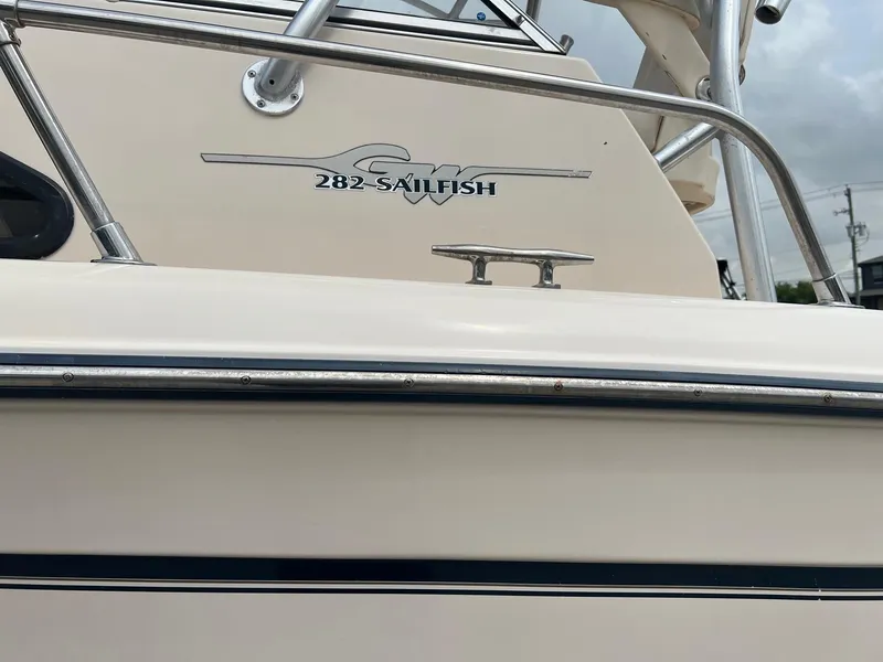 Slide: The Image of 2008 Grady-White 282 Sailfish WA boat, close-up of logo and railing. - 3