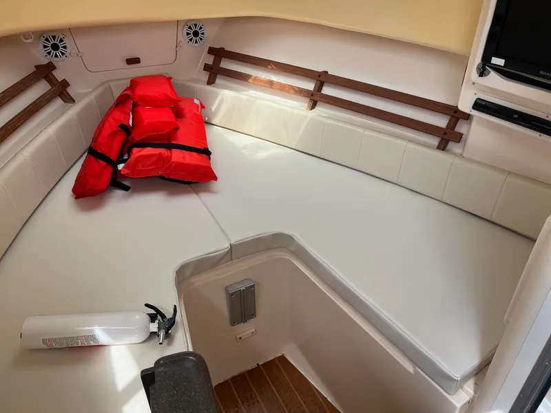 Slide: The Image of 2008 Grady-White 282 Sailfish WA cabin interior with life jackets and fire extinguisher. - 33