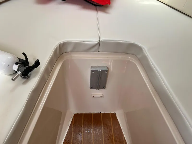 Slide: The Image of 2008 Grady-White 282 Sailfish WA interior with cushioned seating and wooden flooring. - 34