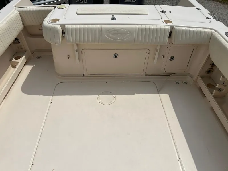Slide: The Image of 2008 Grady-White 282 Sailfish WA boat deck with storage compartments and seating. - 9