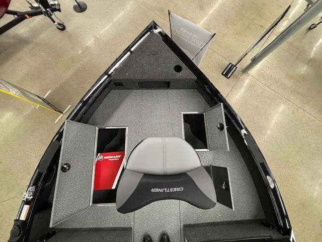 Slide: The Image of 2025 Crestliner 2050 Fish Hawk boat interior with storage compartments and seating. - 10