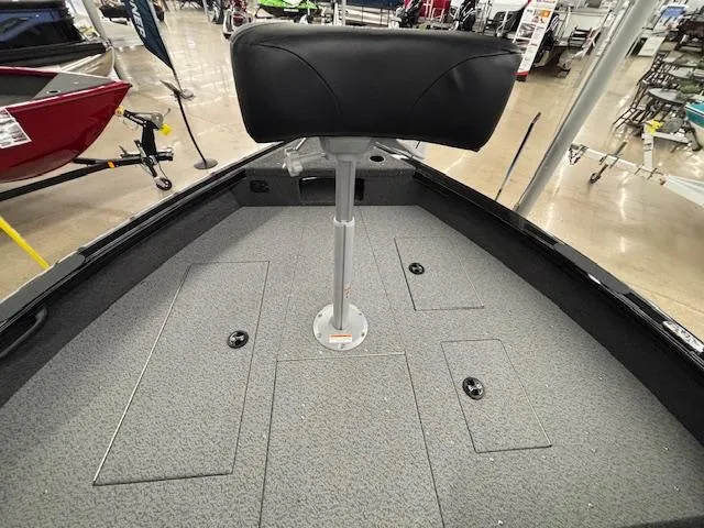 Slide: The Image of 2025 Crestliner 2050 Fish Hawk boat interior with seating and storage compartments. - 11