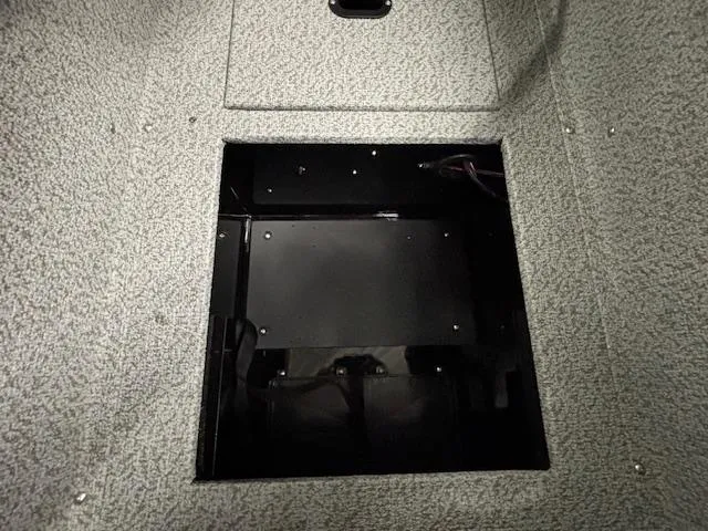 Slide: The Image of 2025 Crestliner 2050 Fish Hawk boat storage compartment, open and empty. - 13