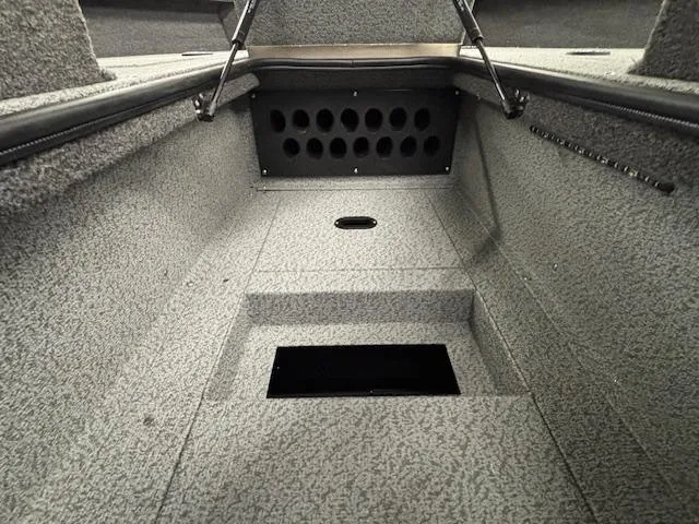 Slide: The Image of 2025 Crestliner 2050 Fish Hawk interior with carpeted storage compartments. - 14