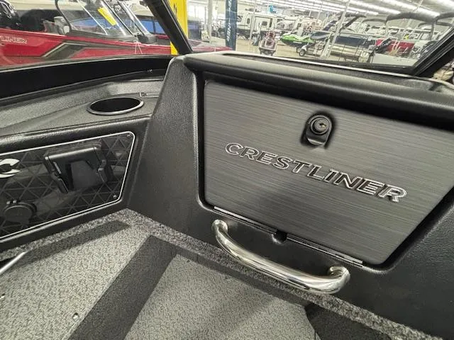 Slide: The Image of 2025 Crestliner 2050 Fish Hawk boat interior with branded glove compartment. - 17