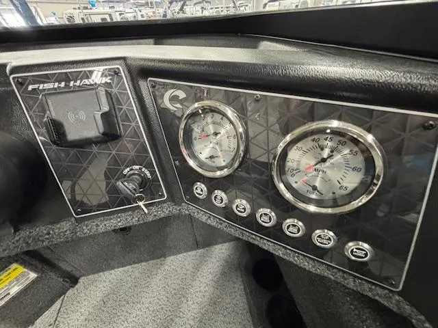 Slide: The Image of Dashboard of 2025 Crestliner 2050 Fish Hawk boat with gauges and controls. - 21