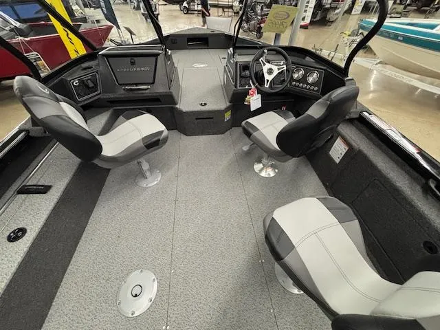 Slide: The Image of 2025 Crestliner 2050 Fish Hawk boat interior with seating and steering console. - 24