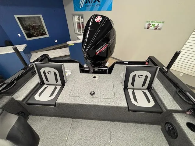 Slide: The Image of 2025 Crestliner 2050 Fish Hawk boat interior with seating and motor. - 6