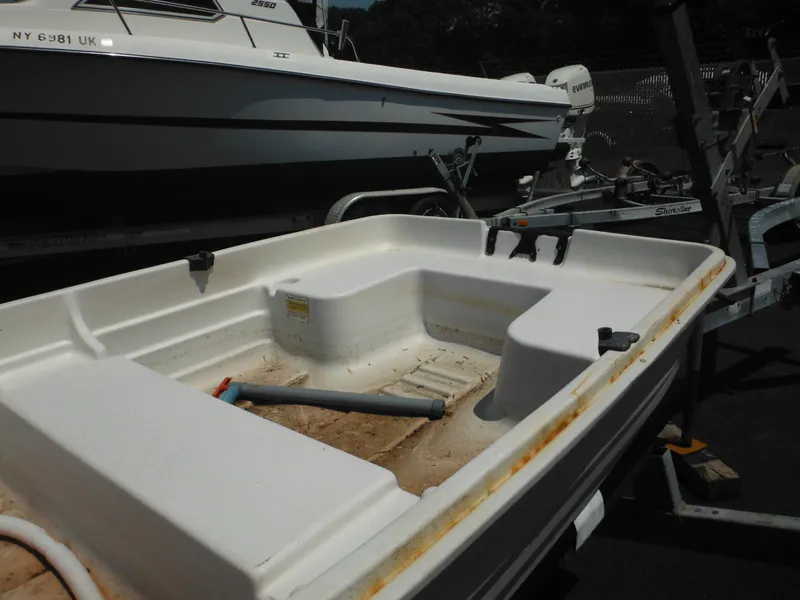 Slide: The Image of Sun Dolphin WATERTENDER 9.4 boat, 2006 model, on trailer, parked outdoors. - 6