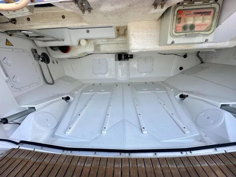 Slide: The Image of Interior view of a 2014 Jeanneau 57 yacht, showcasing a clean, spacious storage compartment. - 13
