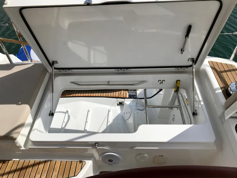 Slide: The Image of Open storage compartment on 2014 Jeanneau 57 yacht with teak decking. - 24