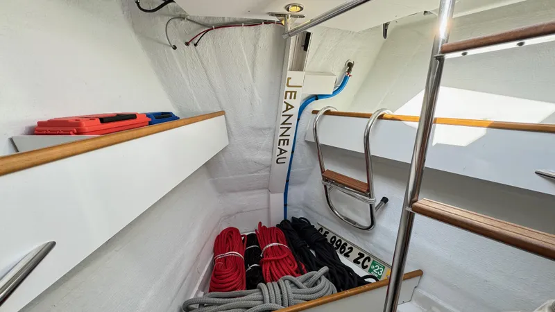 Slide: The Image of Interior of 2014 Jeanneau 57 sailboat with ropes and storage compartments. - 45