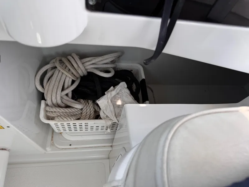 Slide: The Image of Storage compartment with ropes on a 2004 Glacier Bay 2680 Coastal Runner boat. - 16