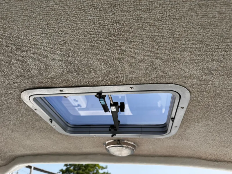 Slide: The Image of Hatch window on 2004 Glacier Bay 2680 Coastal Runner boat ceiling. - 17