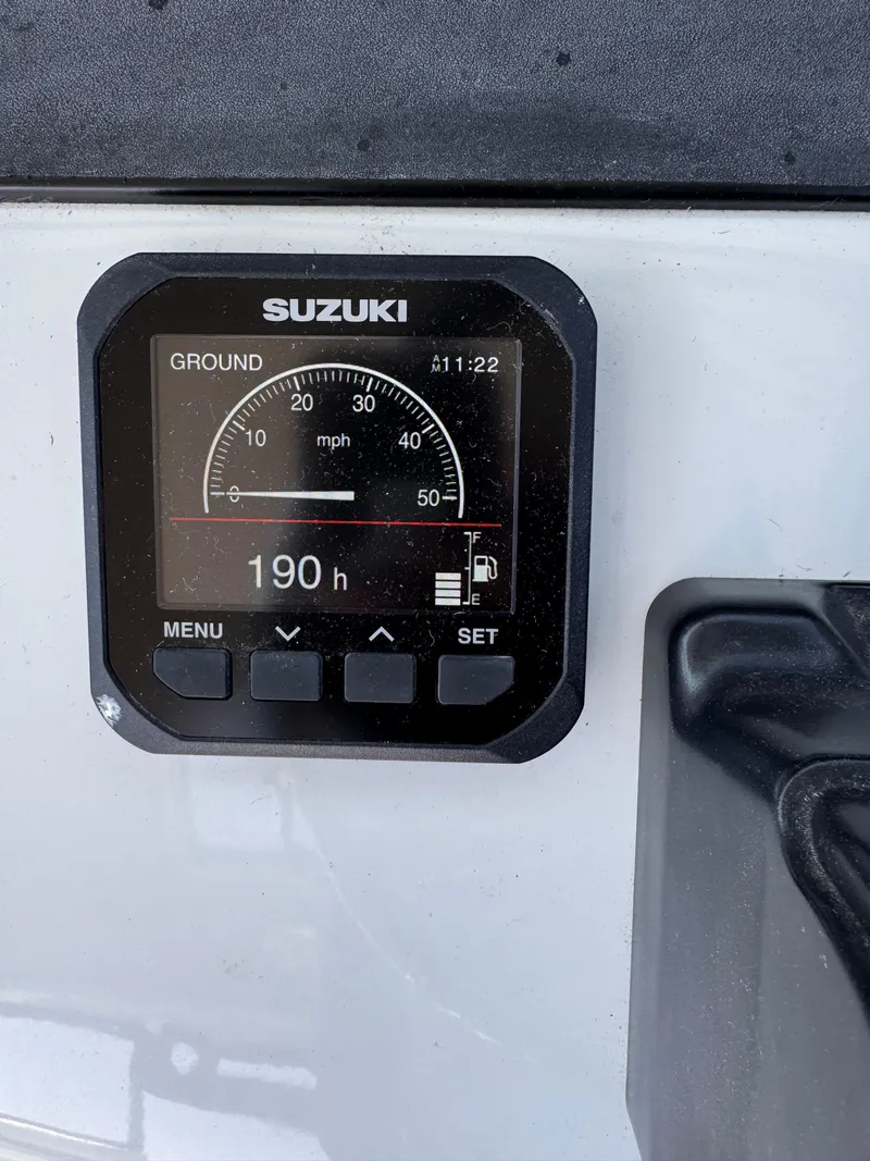 Slide: The Image of Suzuki boat gauge displaying 190 hours on Glacier Bay 2680 Coastal Runner, 2004 model. - 21