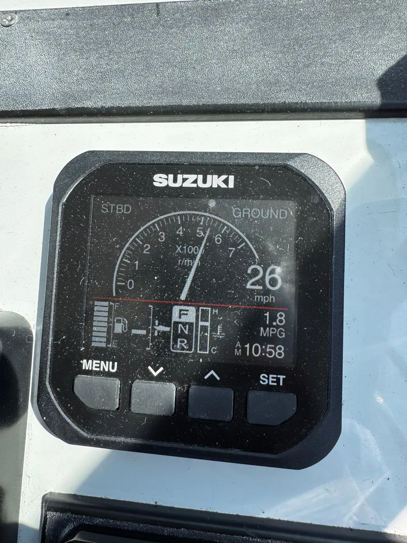 Slide: The Image of Suzuki boat dashboard displaying speed, RPM, and fuel efficiency on Glacier Bay 2680 Coastal Runner. - 29
