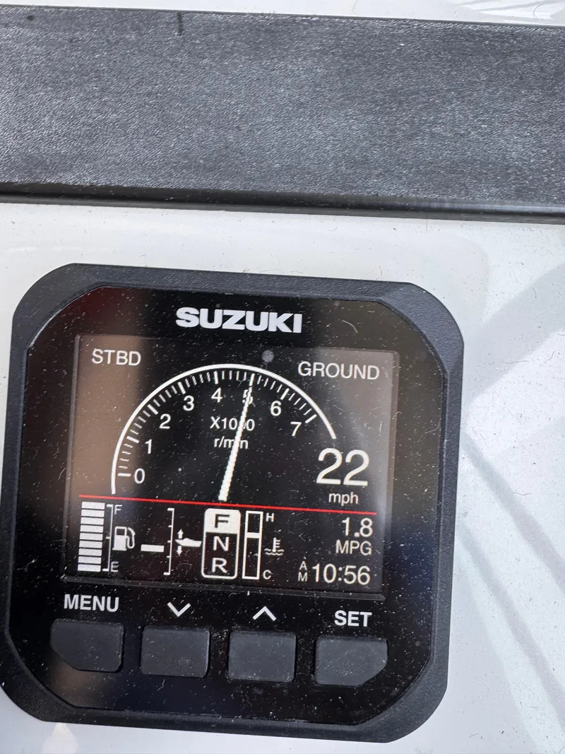 Slide: The Image of Suzuki boat display showing 22 mph speed on Glacier Bay 2680 Coastal Runner, 2004 model. - 30