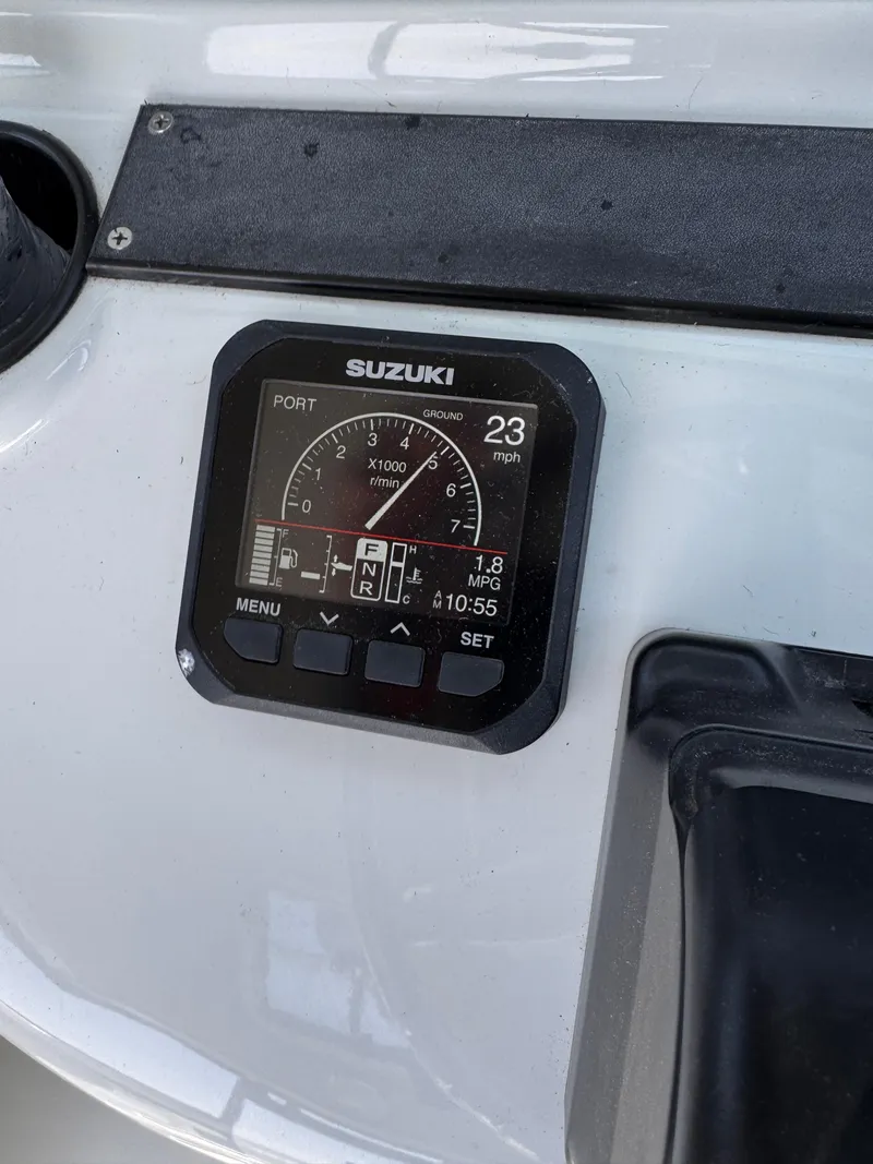 Slide: The Image of Suzuki boat dashboard display on 2004 Glacier Bay 2680 Coastal Runner, showing speed and RPM. - 31
