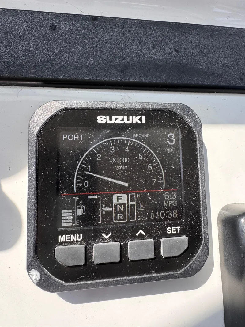 Slide: The Image of Suzuki boat gauge displaying speed, RPM, and fuel data on a 2004 Glacier Bay 2680 Coastal Runner. - 33