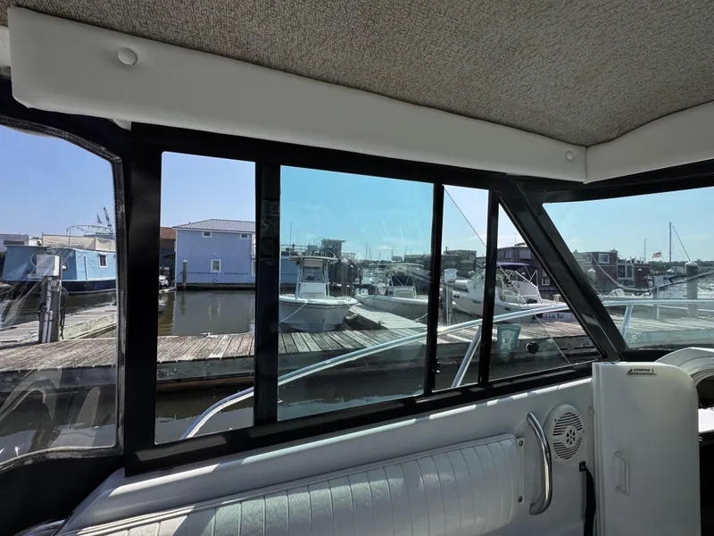 Slide: The Image of Interior view of 2004 Glacier Bay 2680 Coastal Runner at marina dock. - 35