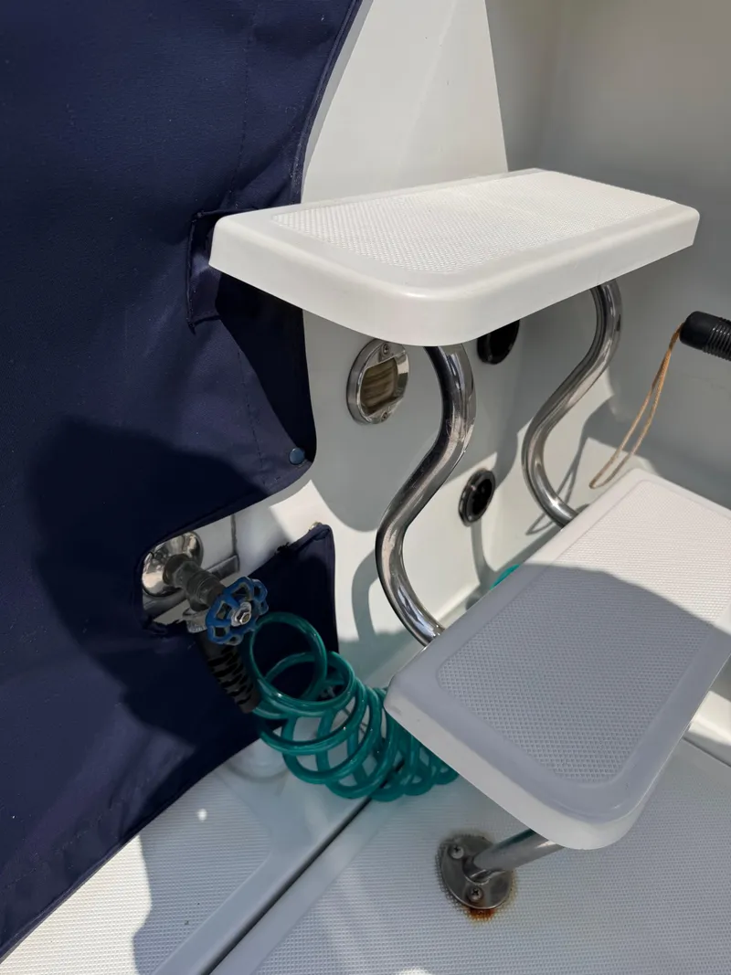 Slide: The Image of Boat interior detail of 2004 Glacier Bay 2680 Coastal Runner with seating and coiled hose. - 43