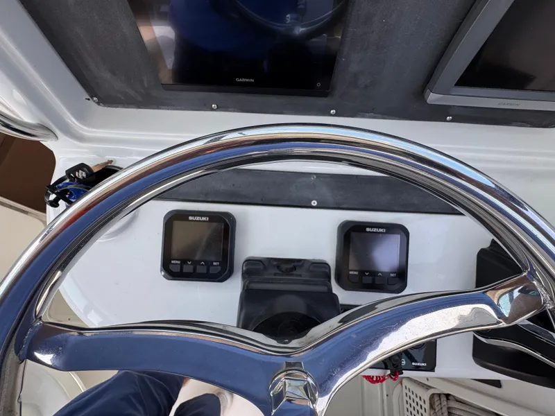 Slide: The Image of Steering wheel and dashboard of 2004 Glacier Bay 2680 Coastal Runner boat. - 45
