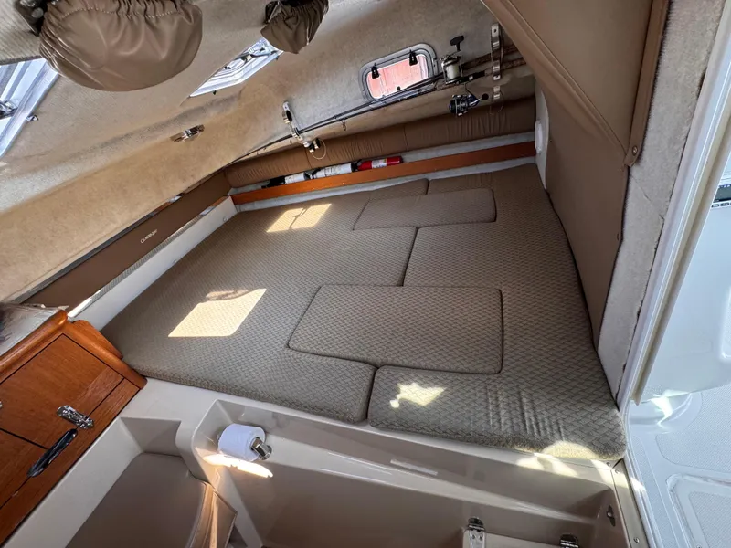 Slide: The Image of Interior cabin of 2004 Glacier Bay 2680 Coastal Runner, featuring a cozy sleeping area. - 47