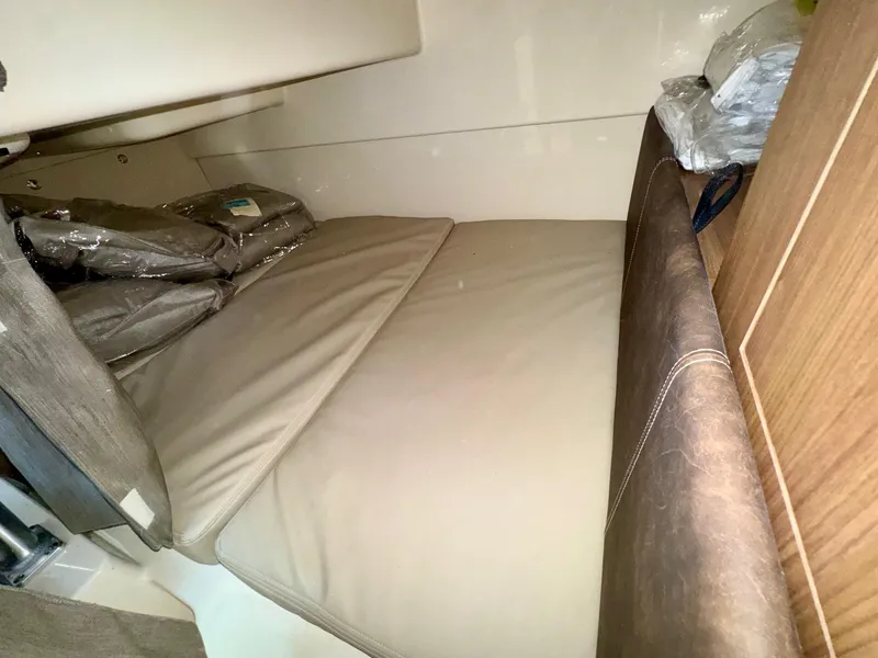 Slide: The Image of Interior cabin of 2018 Boston Whaler 285 Conquest with cushioned seating. - 24