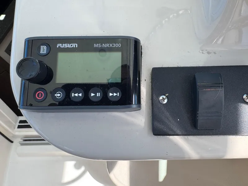 Slide: The Image of Fusion MS-NRX300 audio control panel on 2018 Boston Whaler 285 Conquest boat. - 27