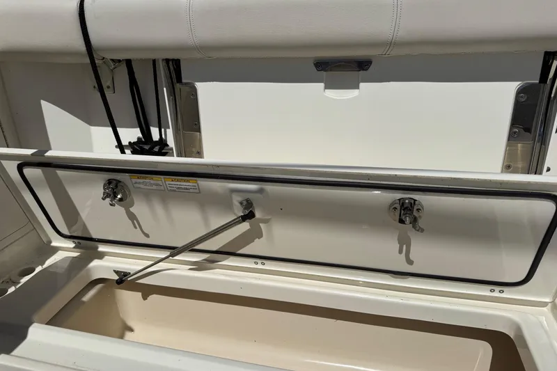 Slide: The Image of Open storage compartment on a 2018 Boston Whaler 285 Conquest boat. - 29