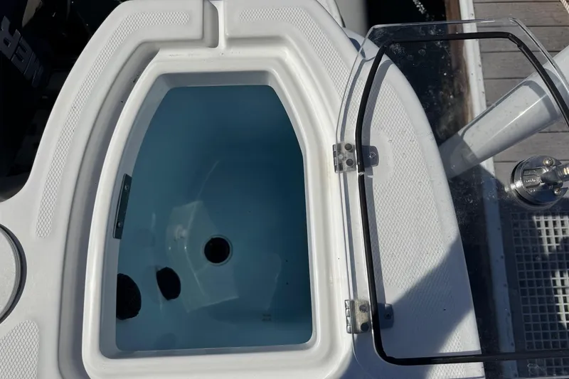 Slide: The Image of Open livewell on 2018 Boston Whaler 285 Conquest boat, showing interior details. - 30