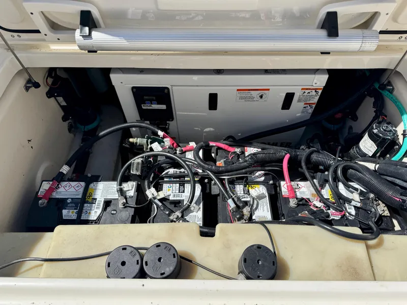 Slide: The Image of Battery compartment of a 2018 Boston Whaler 285 Conquest boat, showing wiring and connections. - 4