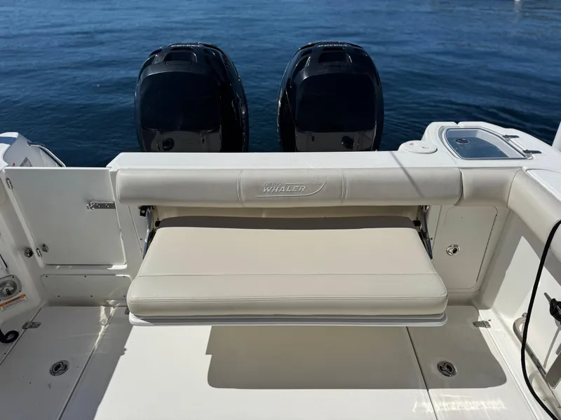 Slide: The Image of 2018 Boston Whaler 285 Conquest boat with dual engines and foldable seating. - 5