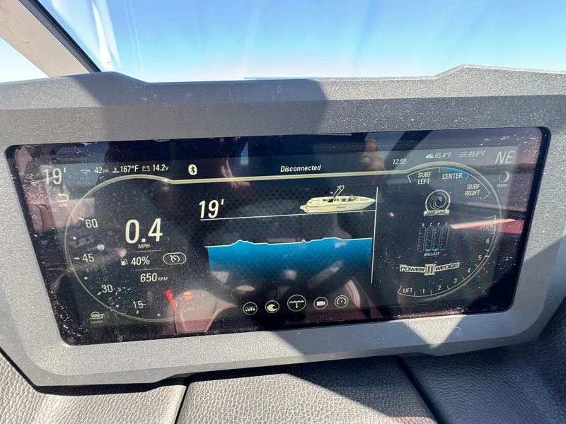 Slide: The Image of Dashboard of 2022 Malibu Wakesetter 24 MXZ showing speed, ballast, and surf settings. - 15