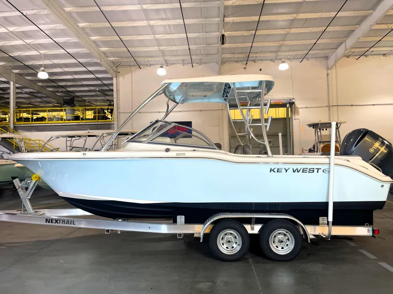 The Image of 2023 Key West 239 DFS boat on trailer in indoor storage. - 0