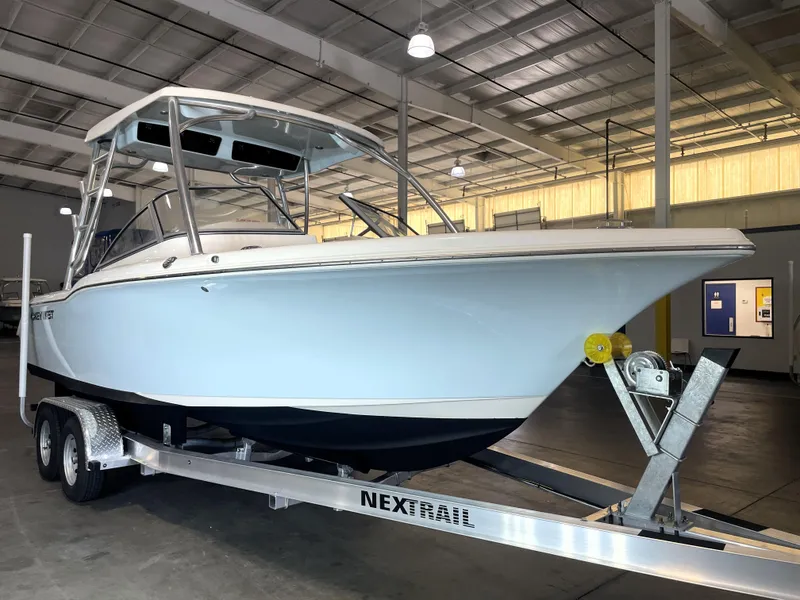 Slide: The Image of 2023 Key West 239 DFS boat in showroom, front view on trailer. - 12