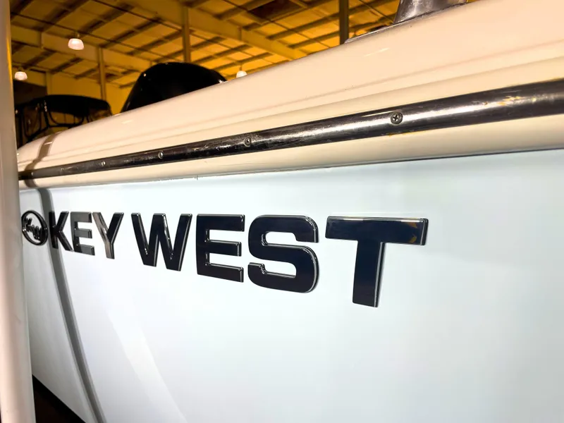 Slide: The Image of 2023 Key West 239 DFS boat logo in a showroom setting. - 17