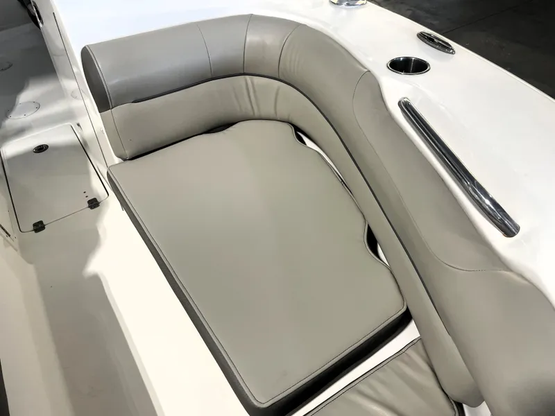 Slide: The Image of 2023 Key West 239 DFS boat interior with gray cushioned seating and cup holders. - 20