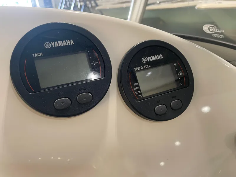 Slide: The Image of Yamaha tachometer and speed fuel gauges on 2023 Key West 239 DFS boat dashboard. - 28