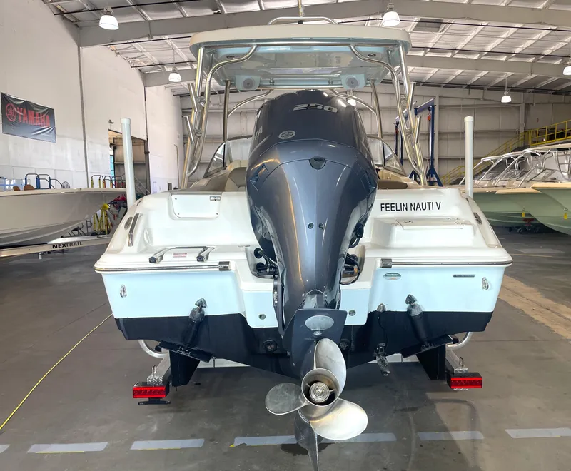 Slide: The Image of 2023 Key West 239 DFS boat on trailer in indoor storage facility. - 3