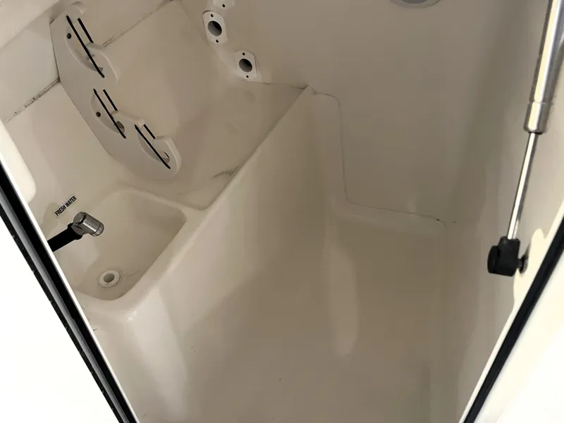 Slide: The Image of 2023 Key West 239 DFS boat interior with fresh water sink and storage. - 30